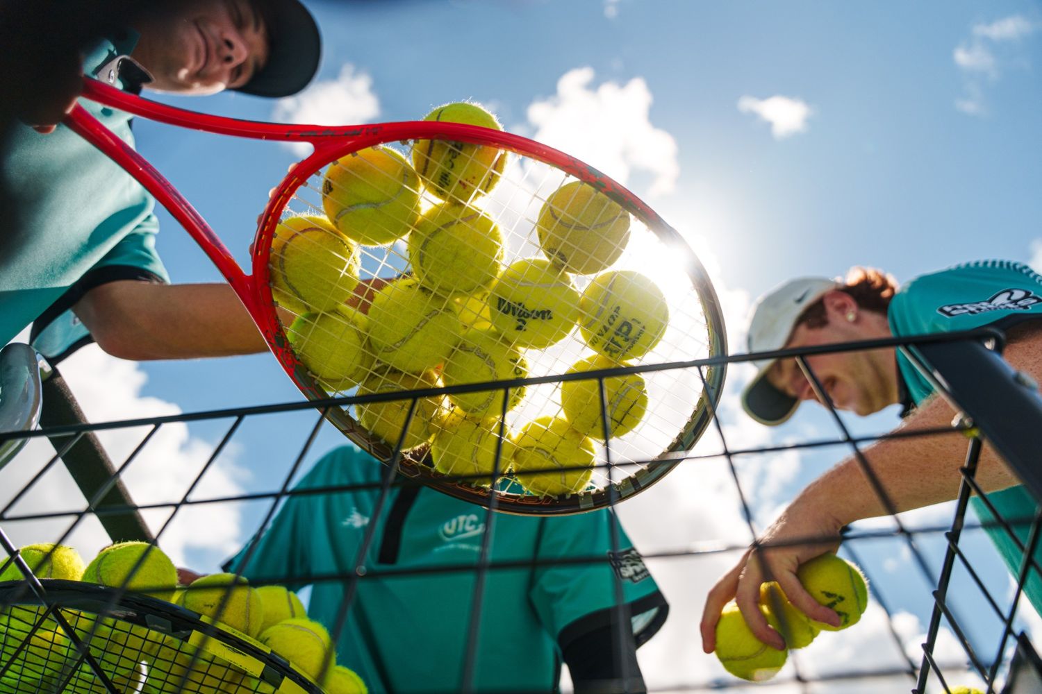 Tennis balls in a racquet seen from below